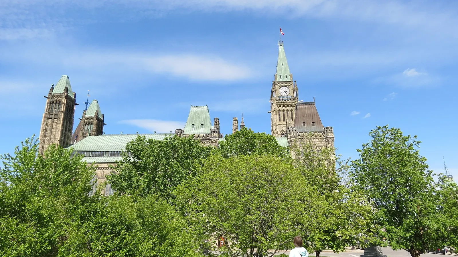 Peace Tower on Parliament Hill, Ottawa, behind summer trees
