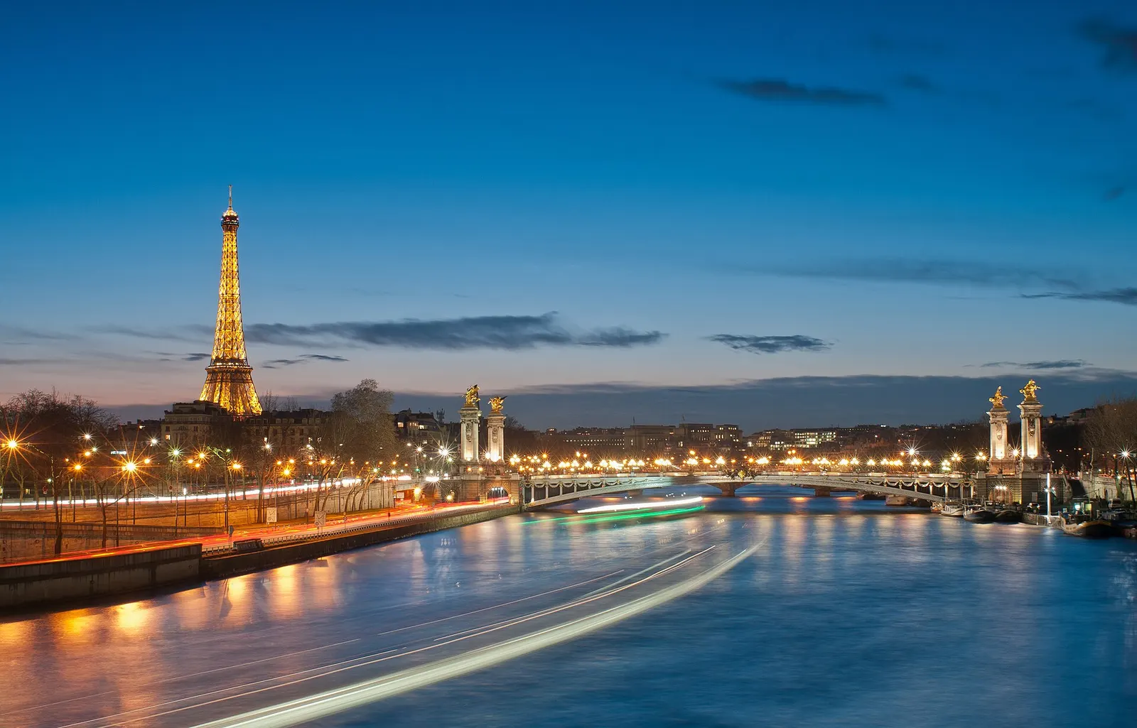 Eiffel Tower and Pont Alexandre III over the Seine at dusk