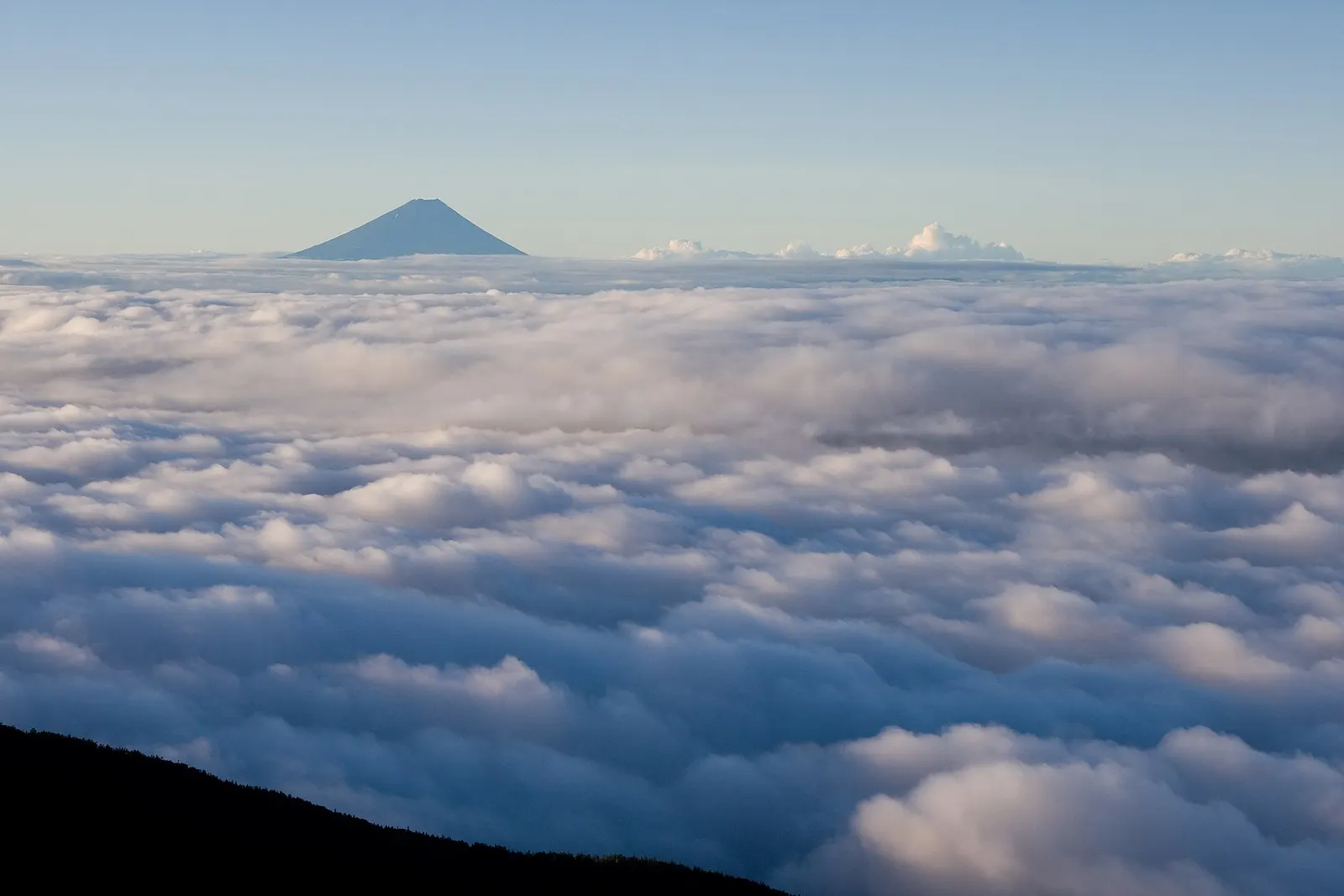 Mount Fuji rising above a sea of clouds