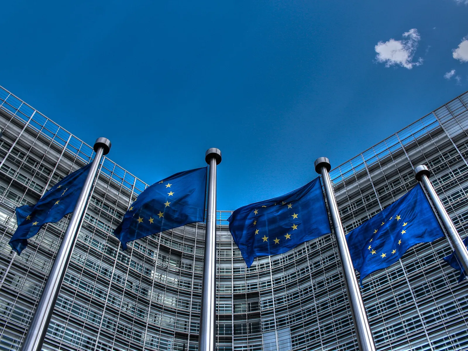 European Union flags flying in front of the Berlaymont building in Brussels