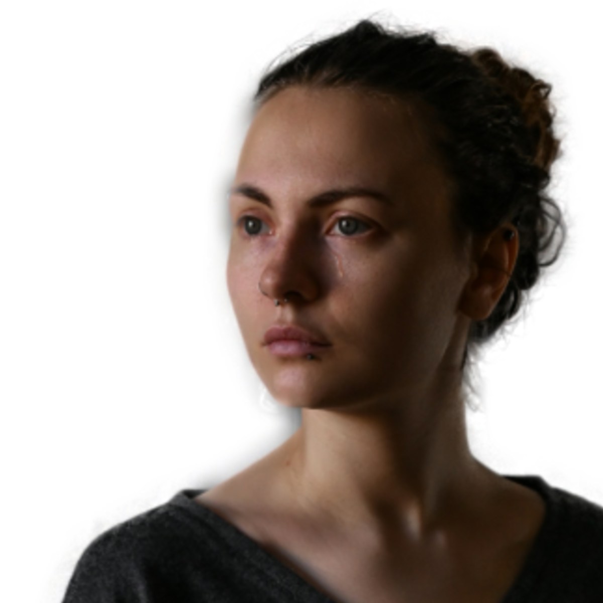 Our crop of the woman against a dark background for a US passport, held back because her face is dark and lit from one side