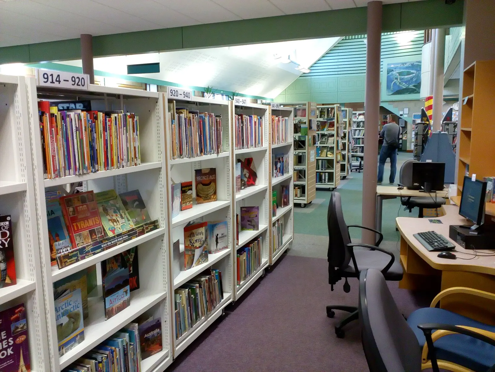 Library and archive shelves lined with reference books